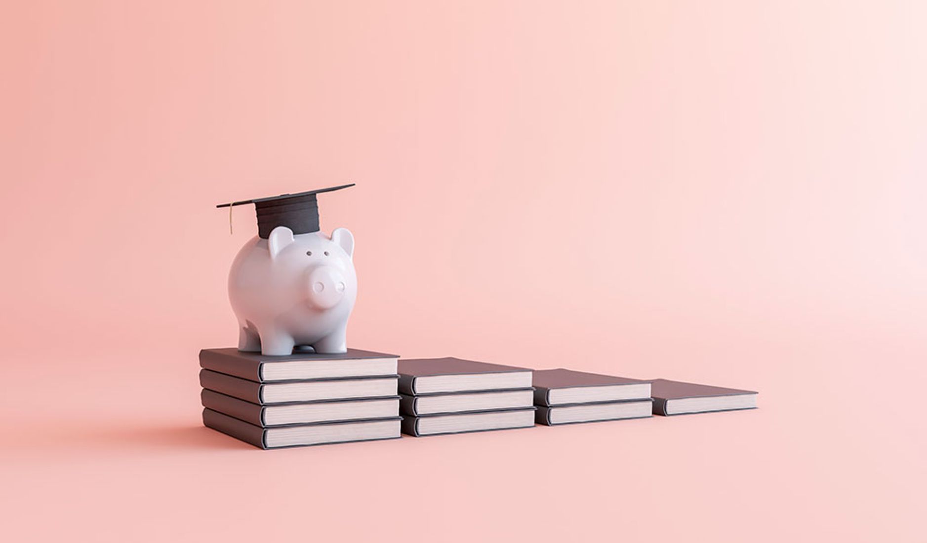 Piggy bank with graduation cap on stack of books, education funding.